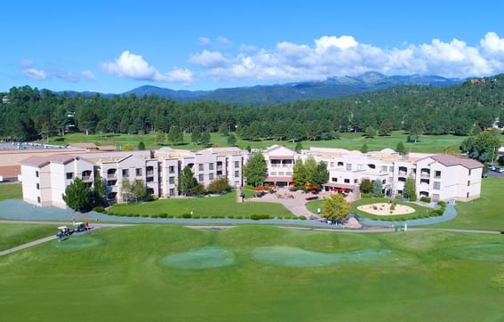 Back exterior & golf course at Elegante Lodge & Resort Ruidoso