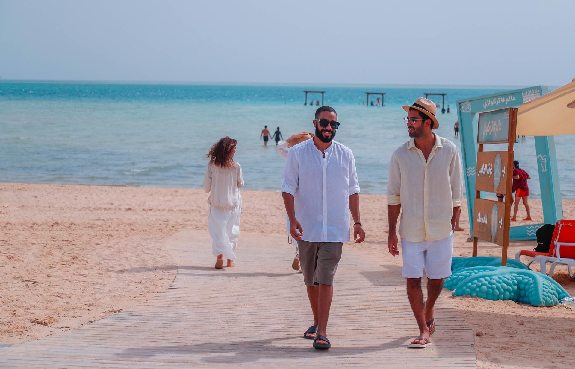 People by the beach near Bay La Sun Hotel & Marina