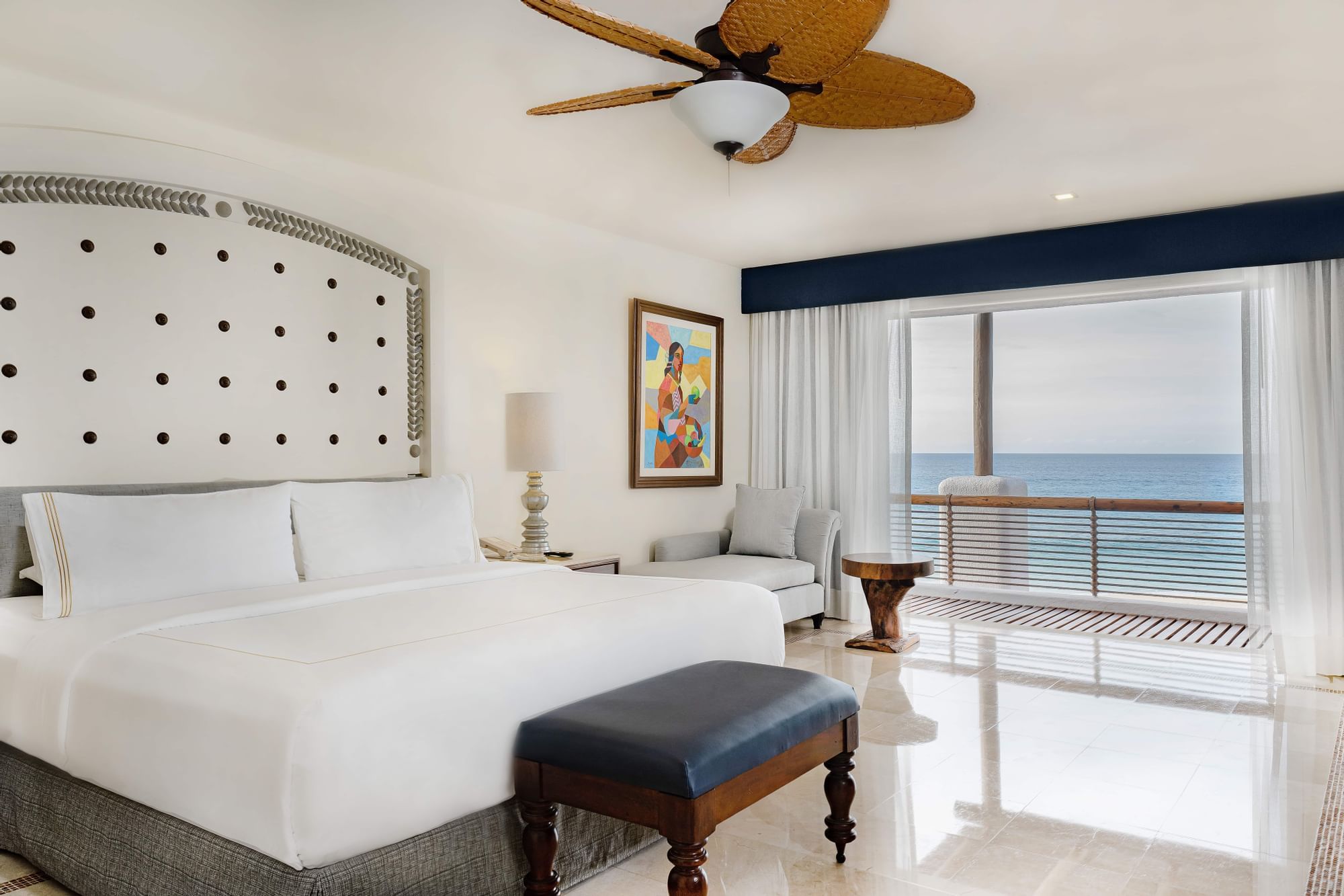 Ottoman and seating area by the bed in Casita Ocean View at Marquis Los Cabos
