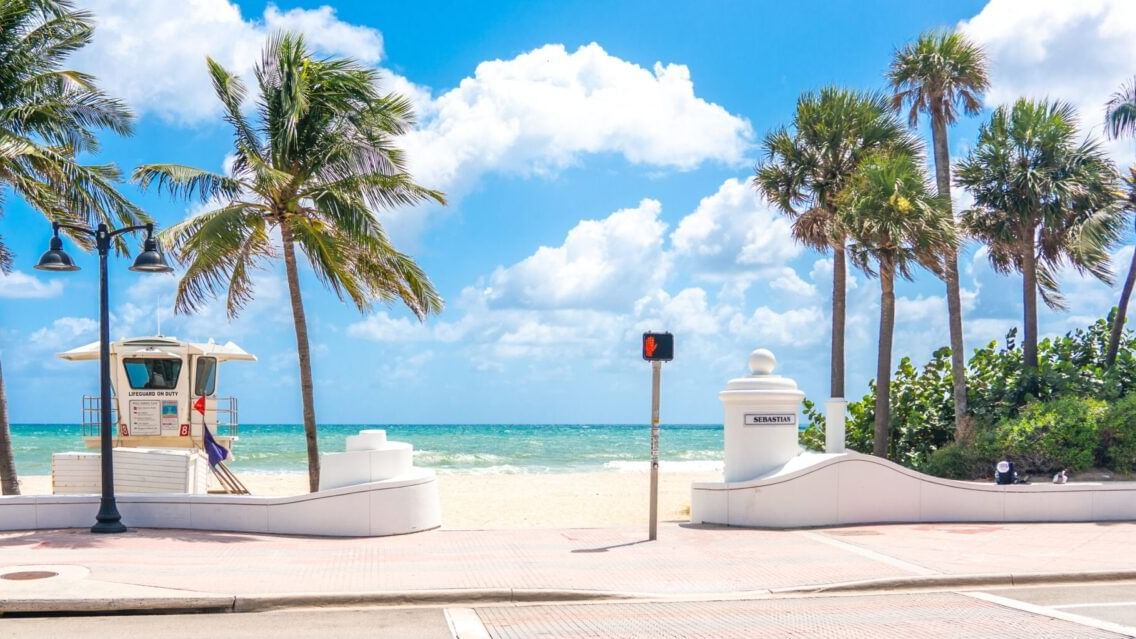 Entrance to the beach, coconut trees at Legacy Vacation Resorts