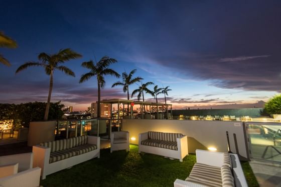 Lounge area near rooftop pool at Boulan South Beach at night