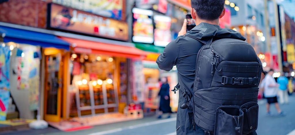 tourist taking in Shinjuku neighborhood