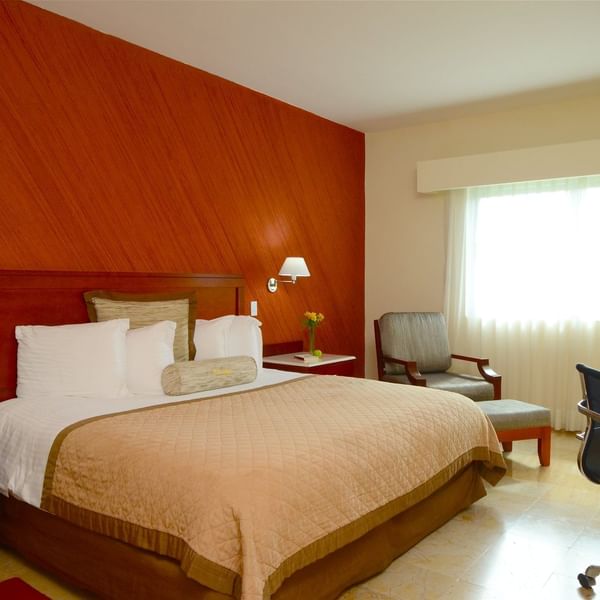 Queen comfy bed in Superior Room at Gamma Hotels
