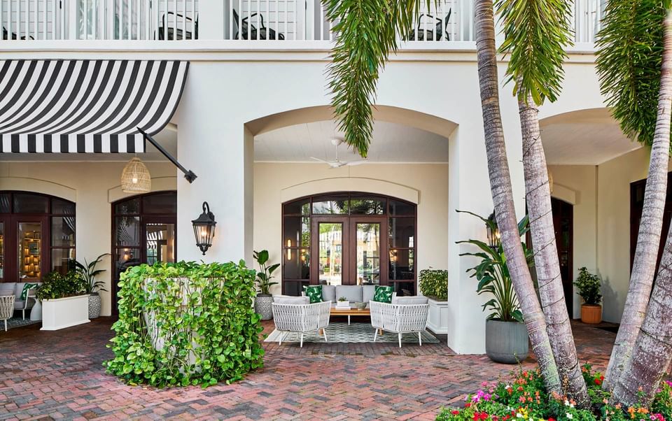 Front porch seating area is perfect for relaxing and planning things to do in celebration Florida at Inn at Celebration