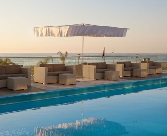 Umbrella & loungers by the outdoor pool at Ocean Place