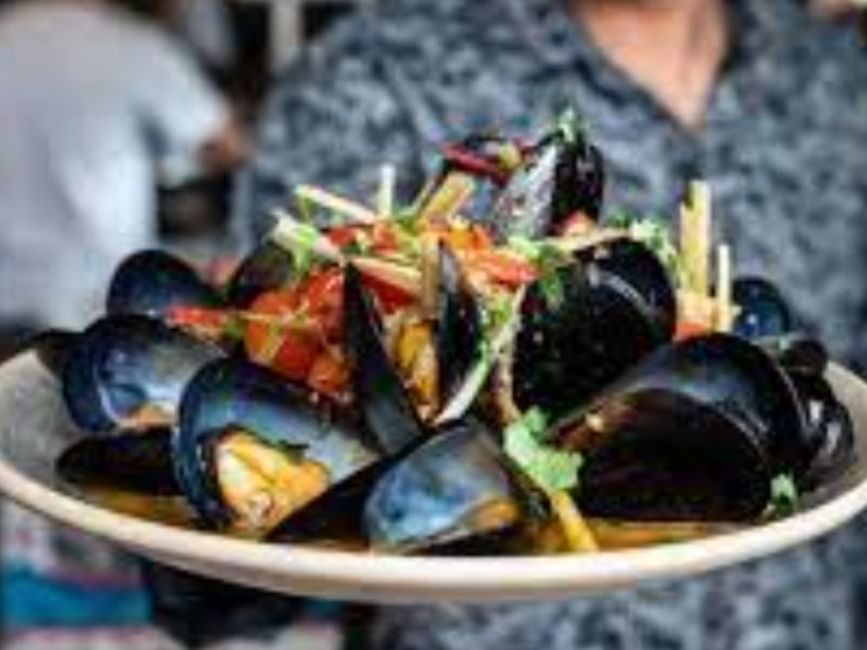 Close-up of a seafood plate served in Claypots Barbarossa at Brady Apartment Hotel Hardware Lane