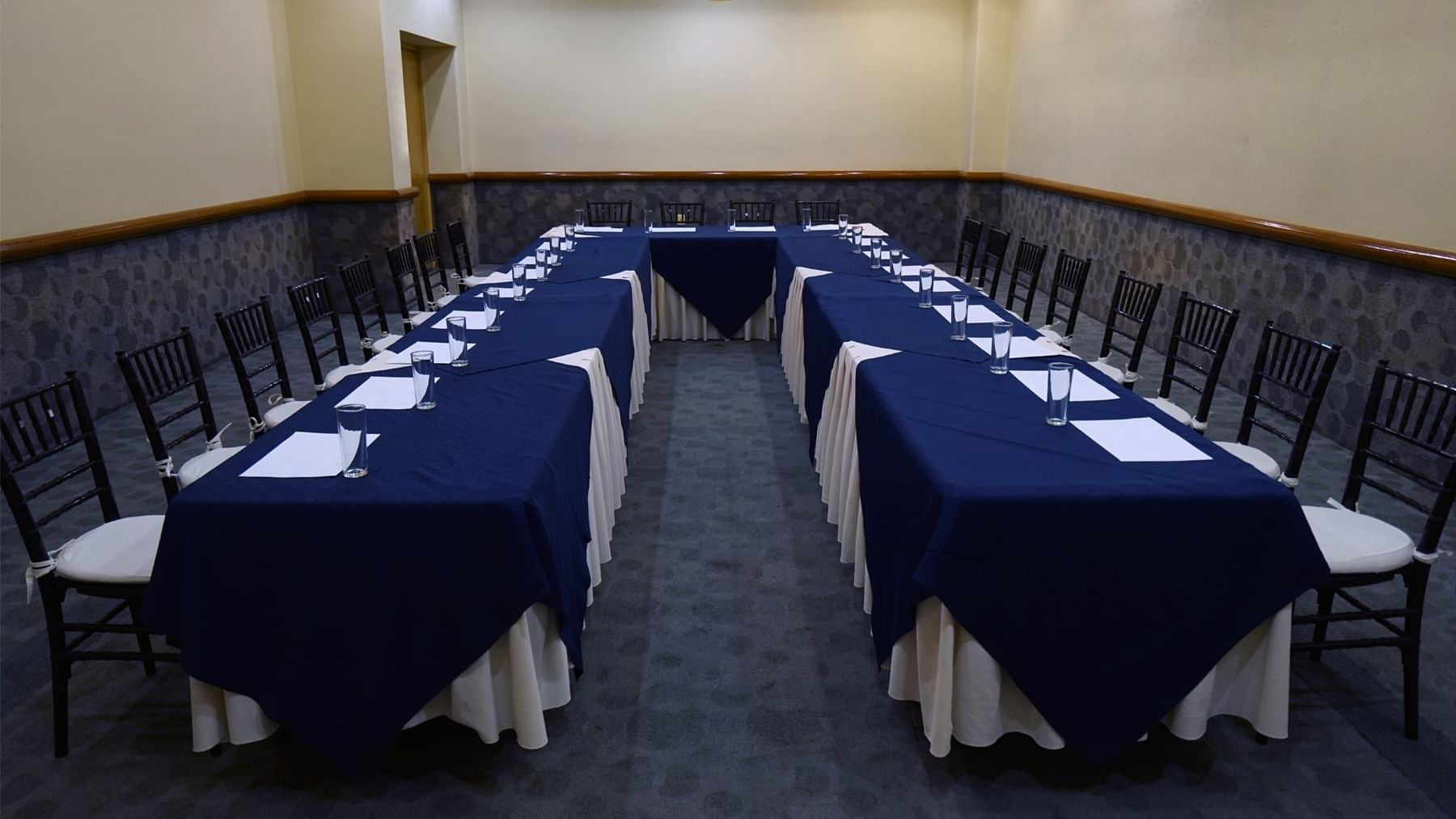 Meeting room with u-shaped table set-up at Gamma Hotels