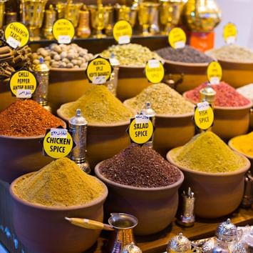 A variety of spices selling on a counter in Spice Bazarr near Titanic Business Kartal