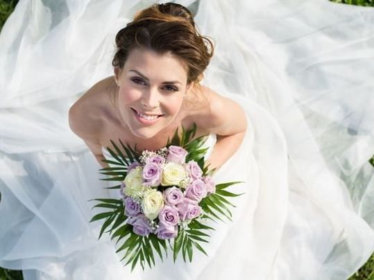 The bride with a beautiful smile at MCM Eleganté Suites