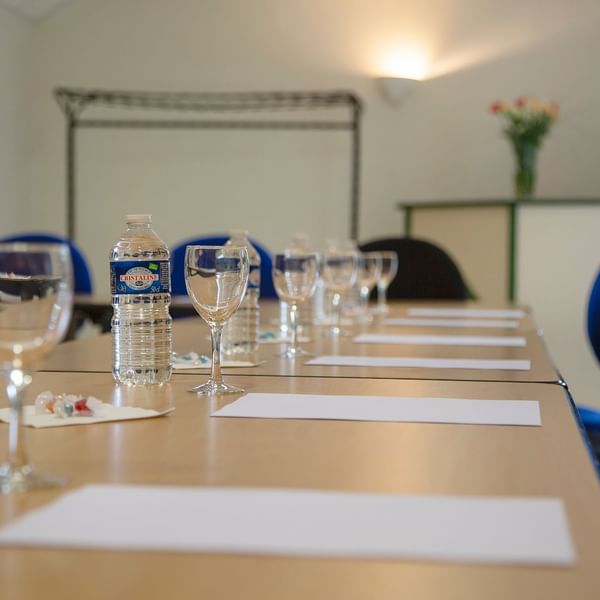 Closeup of arranged meeting table at The Originals Hotels