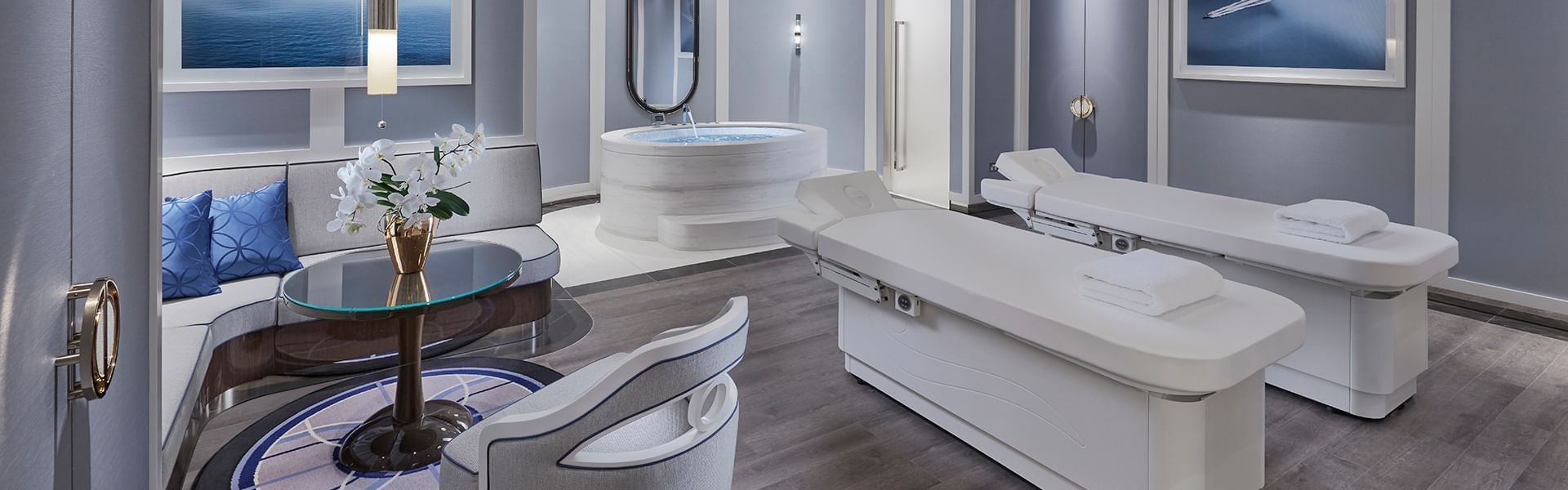 Massage beds and comfy lounge area in Spa Indulgence Suite at Crown Hotels