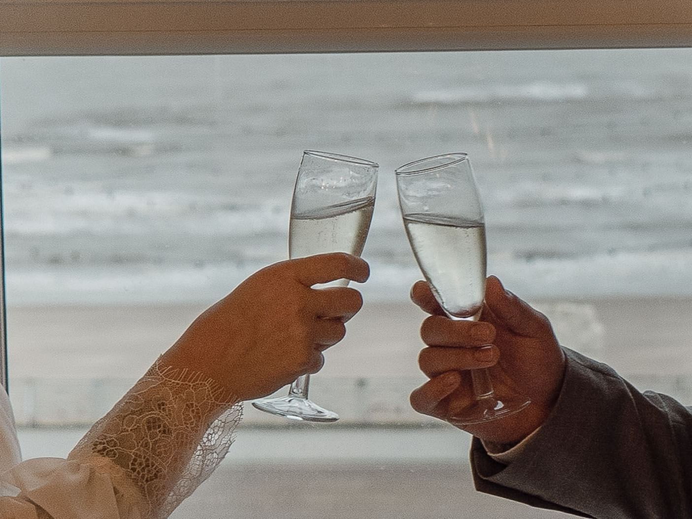 Couple clinking glasses near sea, The Imperial Hotel  Blackpool
