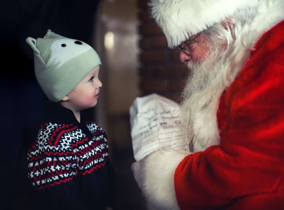 Santa giving gift to the child at The Imperial Hotel Blackpool