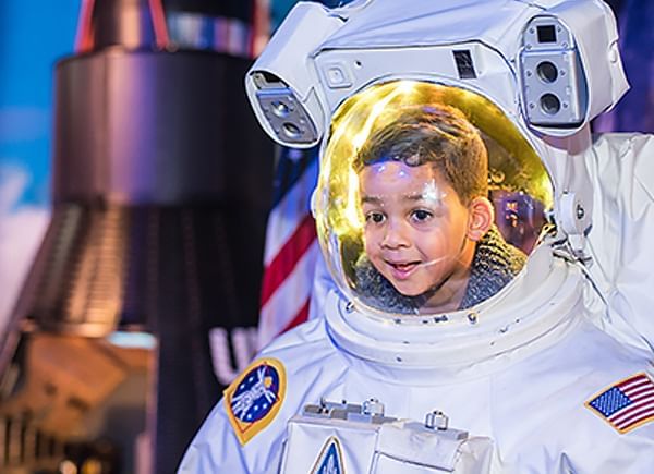 Astronaut in a spacesuit with a reflective gold visor  at WonderWorks near Lake Buena Vista Resort Village & Spa