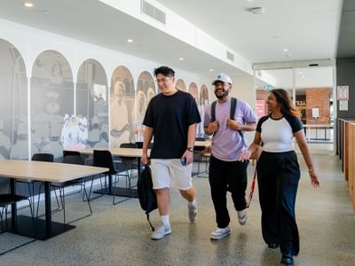Students walking through hallway at UniLodge Herston.