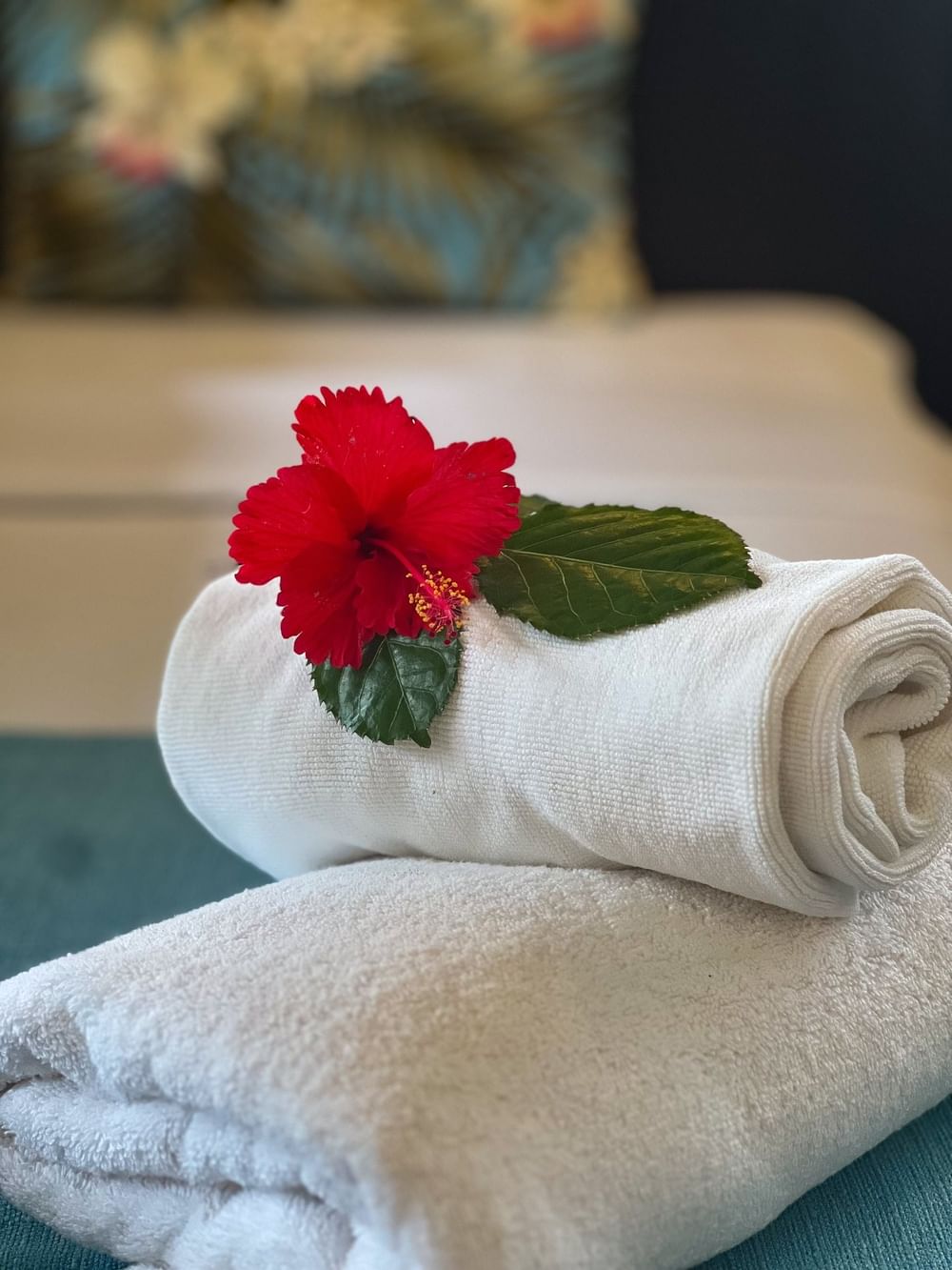 Two towels with red flower at Tokatoka Resort - Fiji International Airport in Nadi.