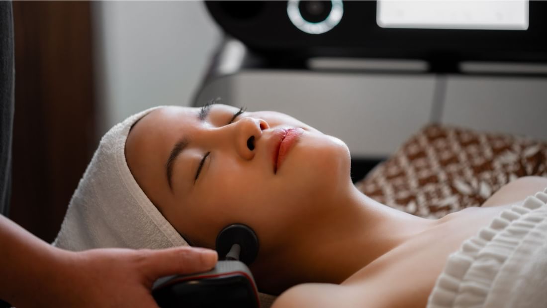 A lady receiving a facial massage in the spa at Sunway Resort