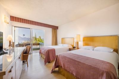 View of the room with two double beds