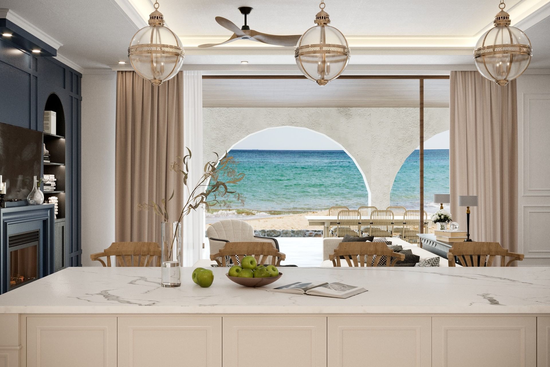 Living area with large kitchen island, fireplace, and dining area in Sogno Villa at A’ila Villas