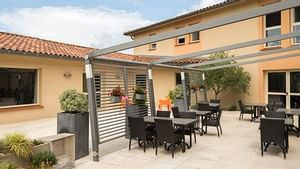 Outdoor dining area at a restaurant in Hotel Le Caussea