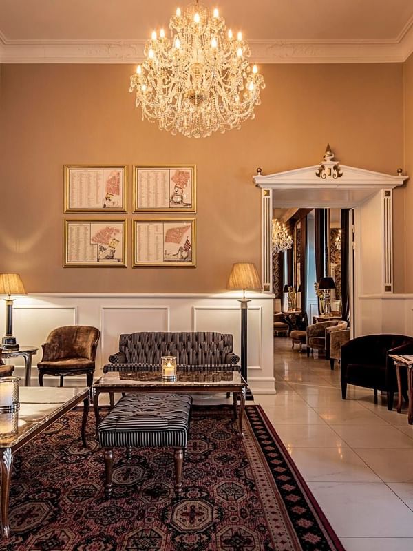 Elegant The Living Room lounge with chandelier and furniture at Kokkedal Slot Copenhagen by Warwick in Hørsholm.