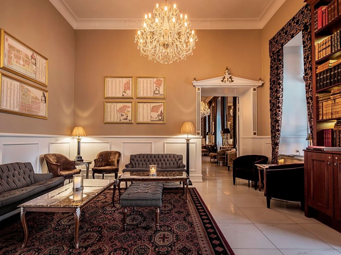 Elegant The Living Room lounge with chandelier and furniture at Kokkedal Slot Copenhagen by Warwick in Hørsholm.