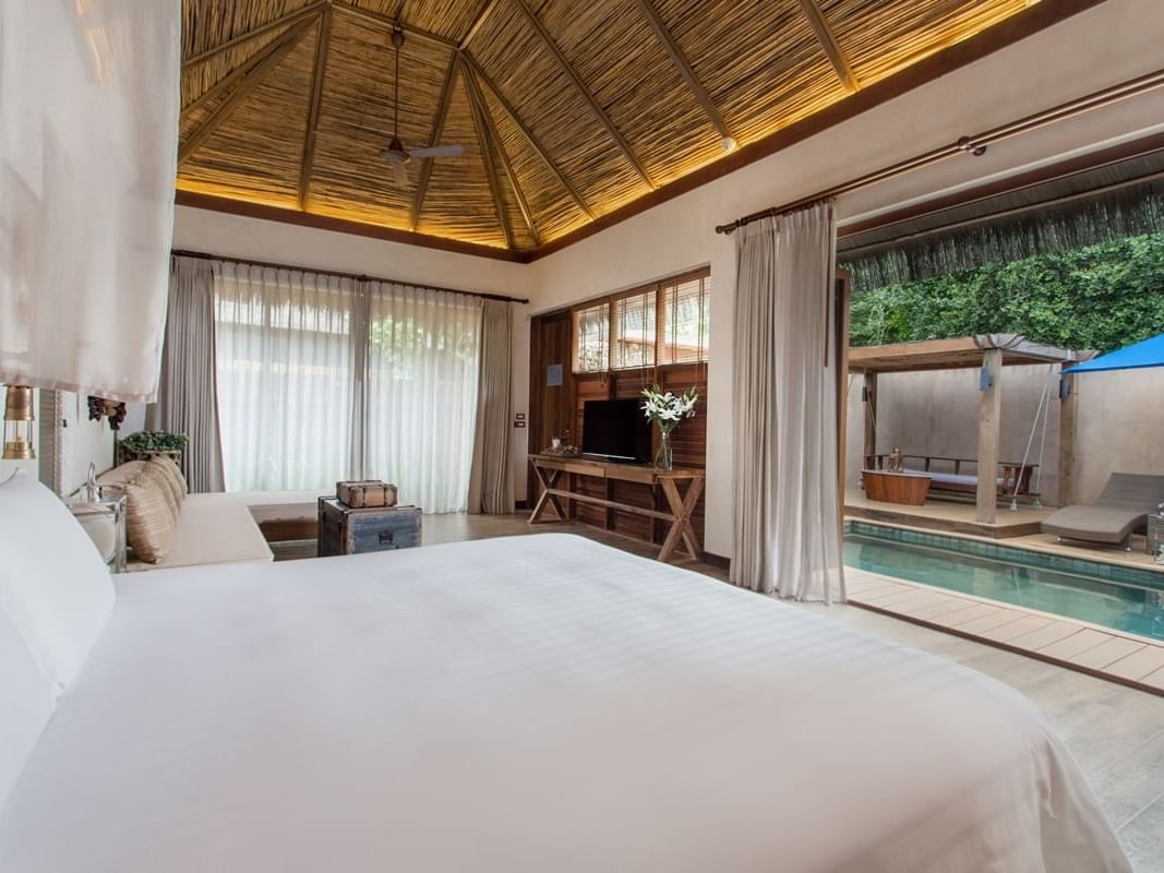 Comfy white sheeted bed in Pool Villa at U Hotels and Resorts
