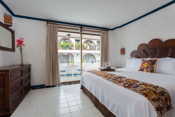 King bed, desk & balcony in a Suite at Casa Dona Susana