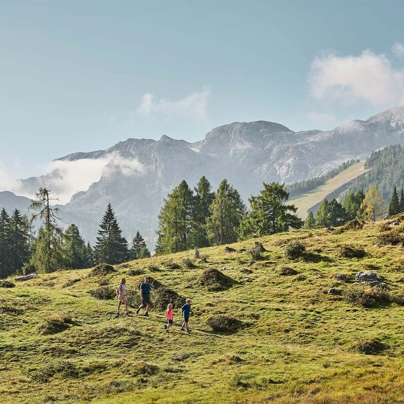 A family going on a hike near Falkensteiner Hotels & Residences