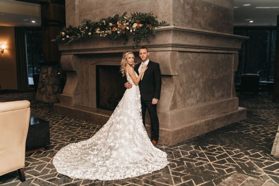 Newlywed posing in their ceremony at The Malcolm Hotel