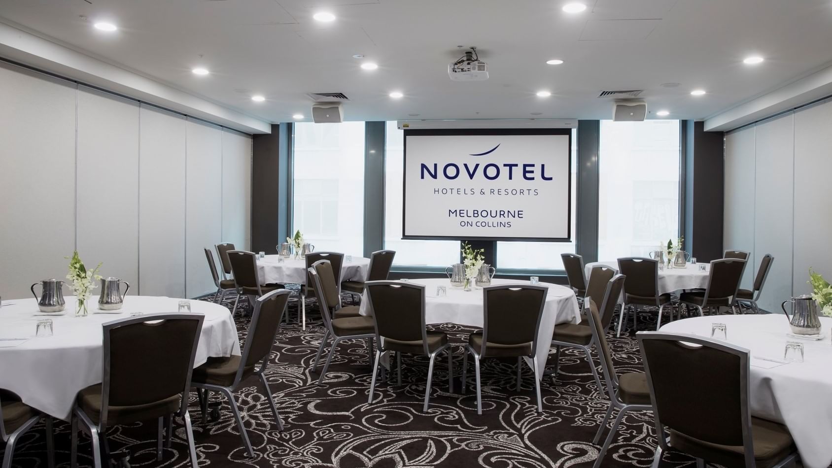 Banquet tables setup for meeting at Novotel Melbourne on Collin