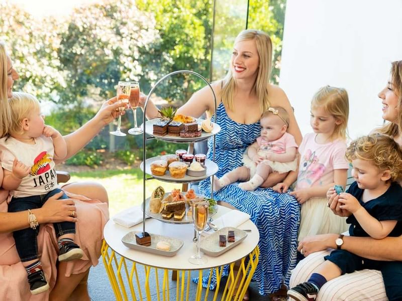 Ladies & kids enjoying High Tea at Pullman Magenta Shores