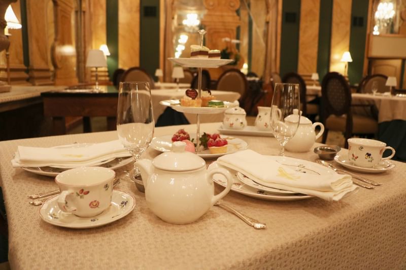 Elegant tea table at Chez Philippe with Peabody's signature pastries, offering a English afternoon tea experience in Memphis