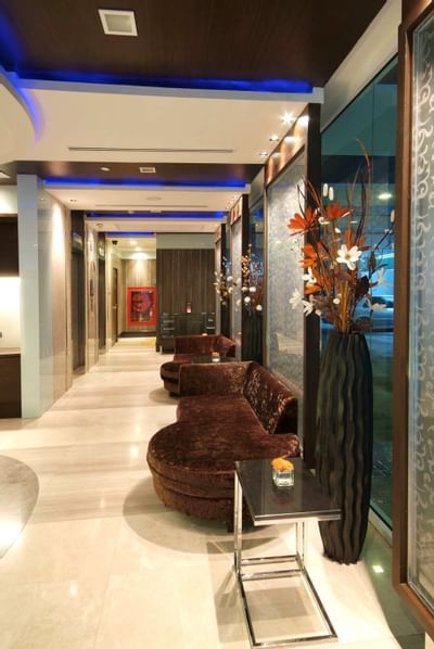 Lobby area with comfortable chairs at Amora Neoluxe Hotel