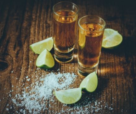 Two shots of Tequila with lime and salt served in The Kitchen at Pensativo House Hotel