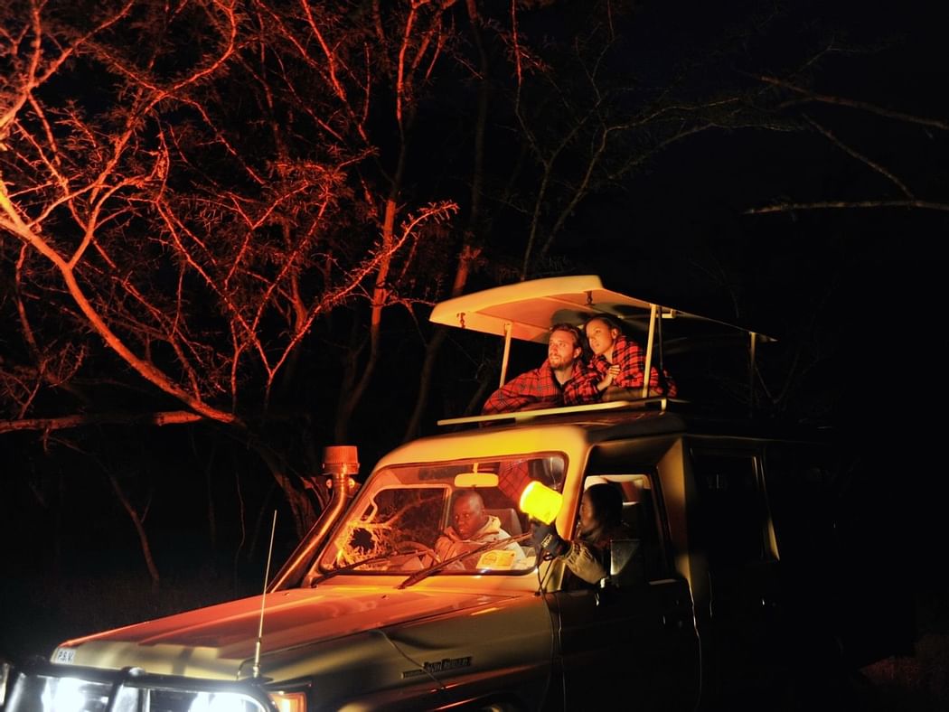 Tourists on a Night Game Drive at Sweetwaters Serena Camp
