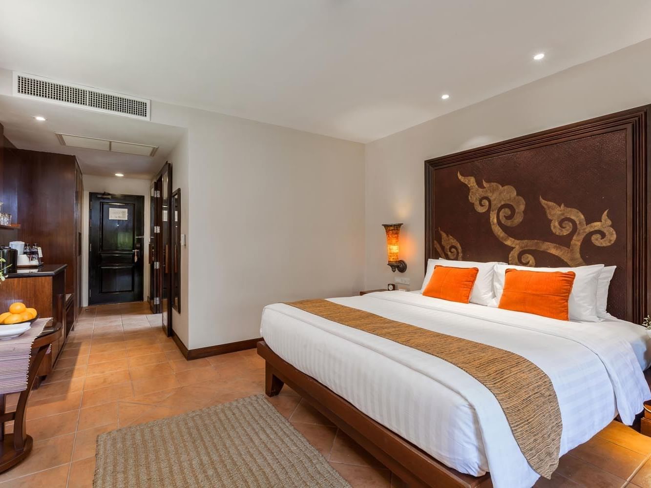 A double bed in a Cottage room at Paradox Hotels & Resorts