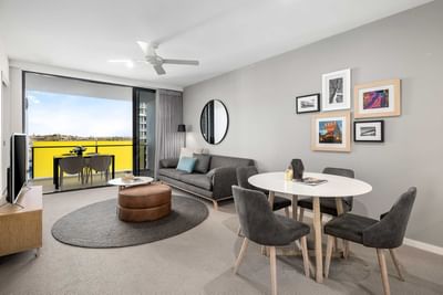 Living area with arranged seating and balcony in Two Bedroom Two Bathroom Apartment at Alcyone Hotel Residences