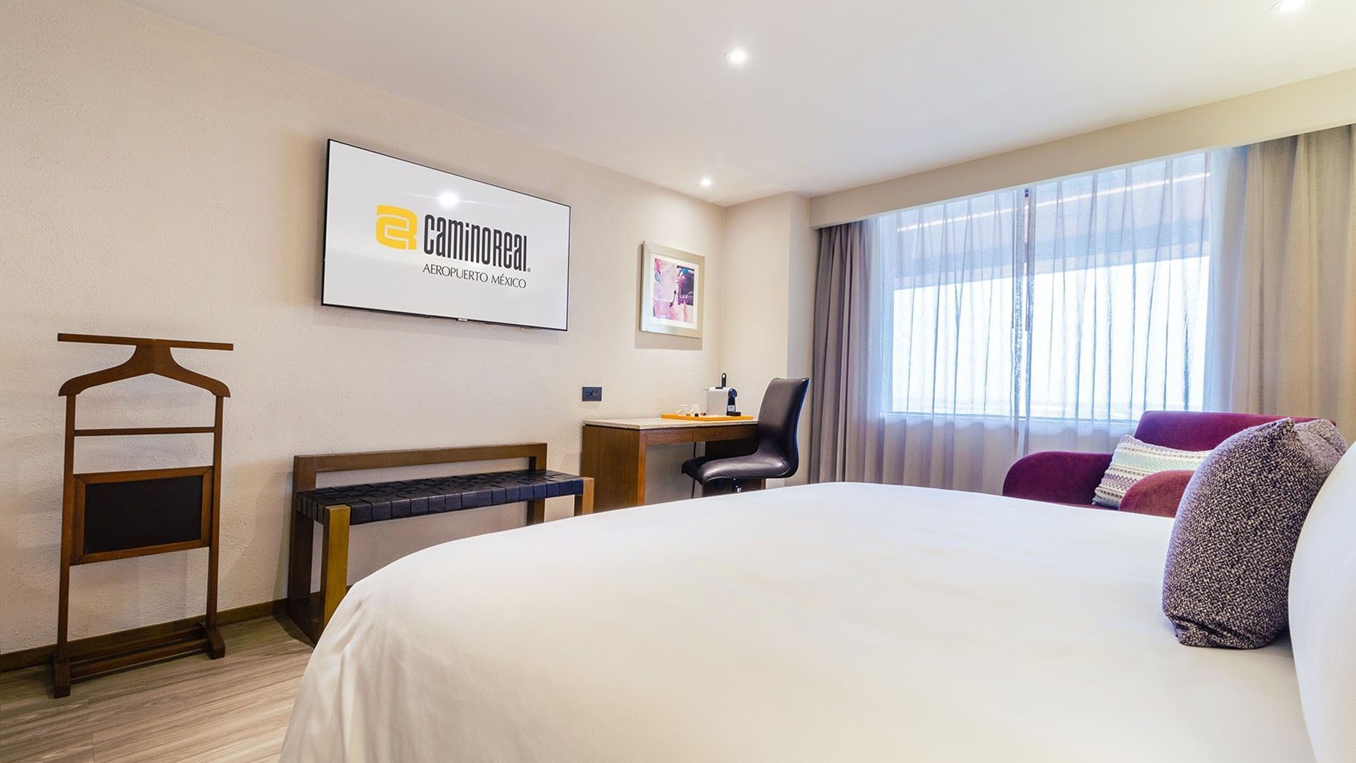 TV with work desk facing the bed by the window in King Camino Real Club at Camino Real Aeropuerto Mexico