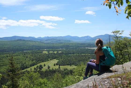 A lady enjoying nature near High Peaks Resort