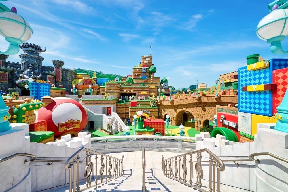 Marble steps leading down to a colorful world of mushrooms, blocks, pipes, and more. 
