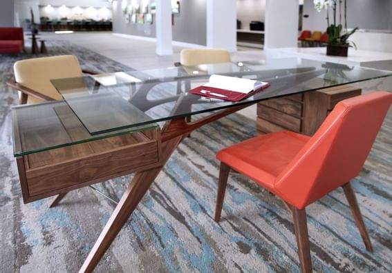 Book on a glass desk in Business Center at The Anaheim Hotel