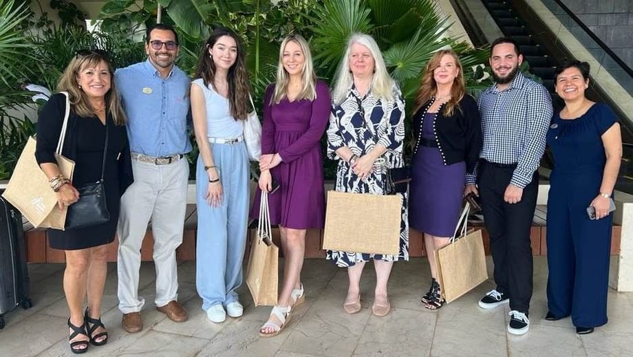 Team Travelty smiling and posing for a photo representing Fiesta Americana Travelty family