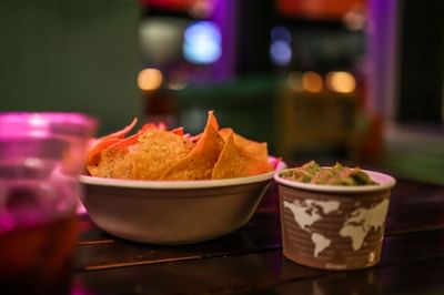 Nachos served with dipping cream on a table at Fairwind Hotel Miami