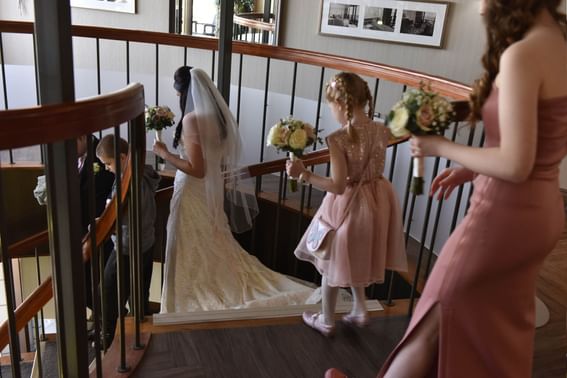 Bride & bridesmaids going downstairs at The View Eastbourne