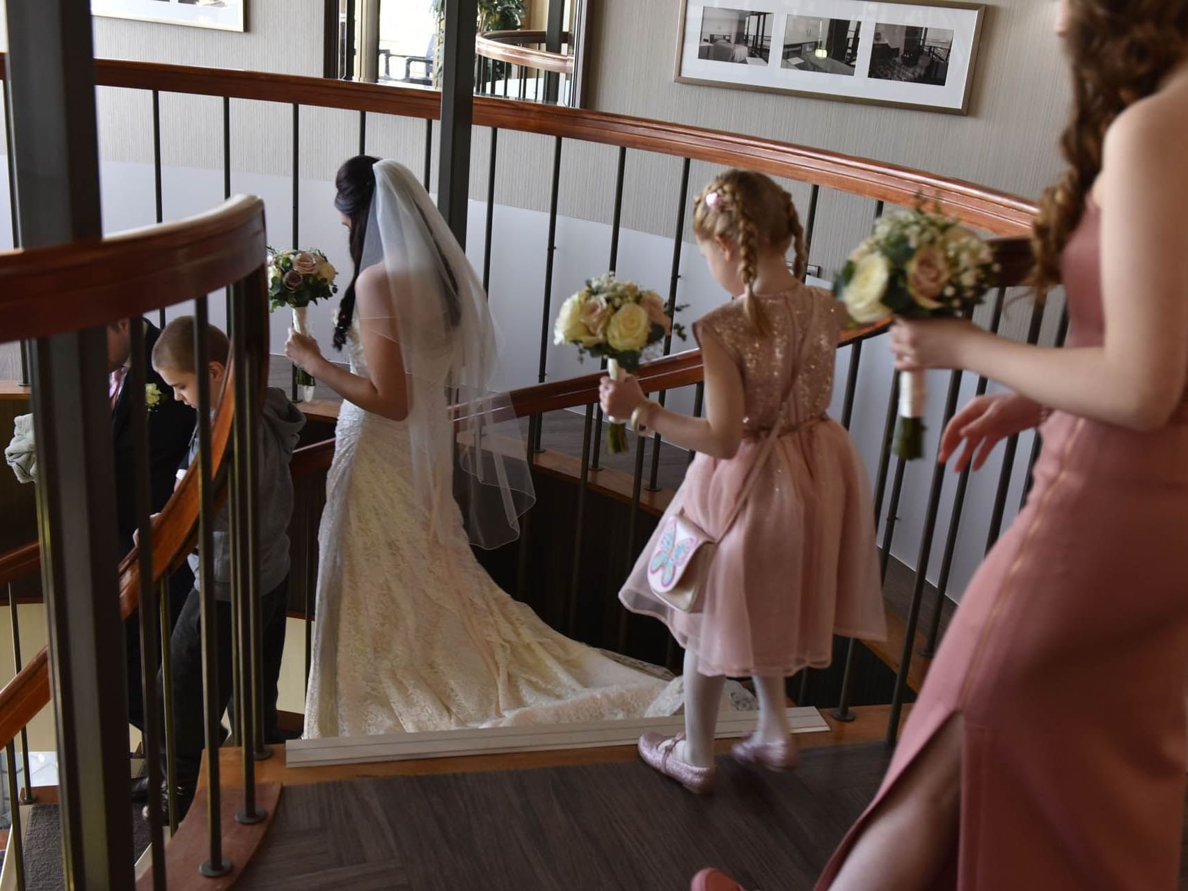 Bride & bridesmaids going downstairs at The View Eastbourne