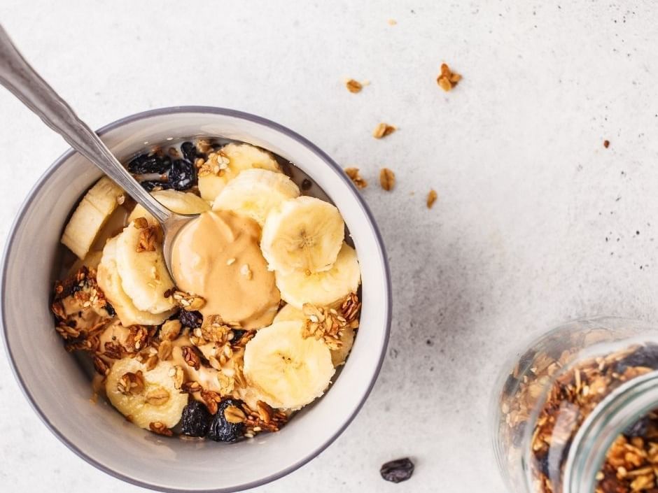 Breakfast bowl served with a spoon at Amora Hotel