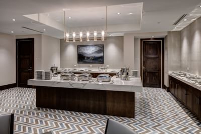 The 7880 Club buffet spread with glassware arranged at Stein Eriksen Residences