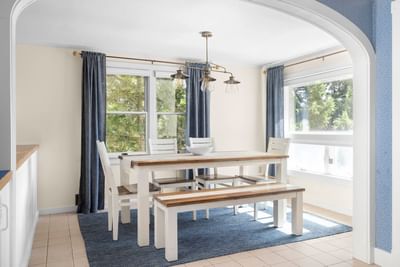 Dining area with carpeted floors in Eventide 4 bedroom House at Chatham Tides Resort
