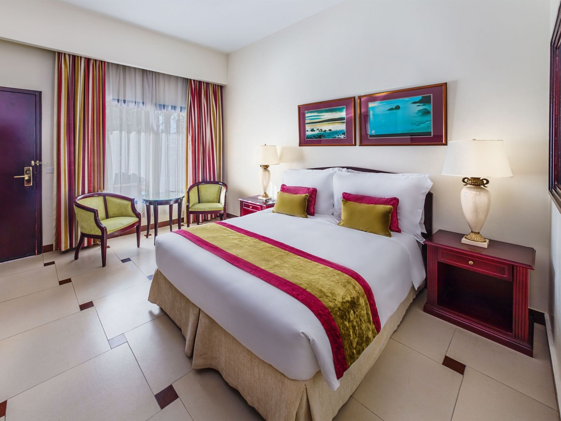 King bed in Laguna poolside room at Ajman Hotel